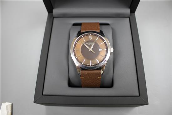 A gentlemans modern stainless steel Victorinox Swiss Army quartz wrist watch, with baton numerals and date aperture
